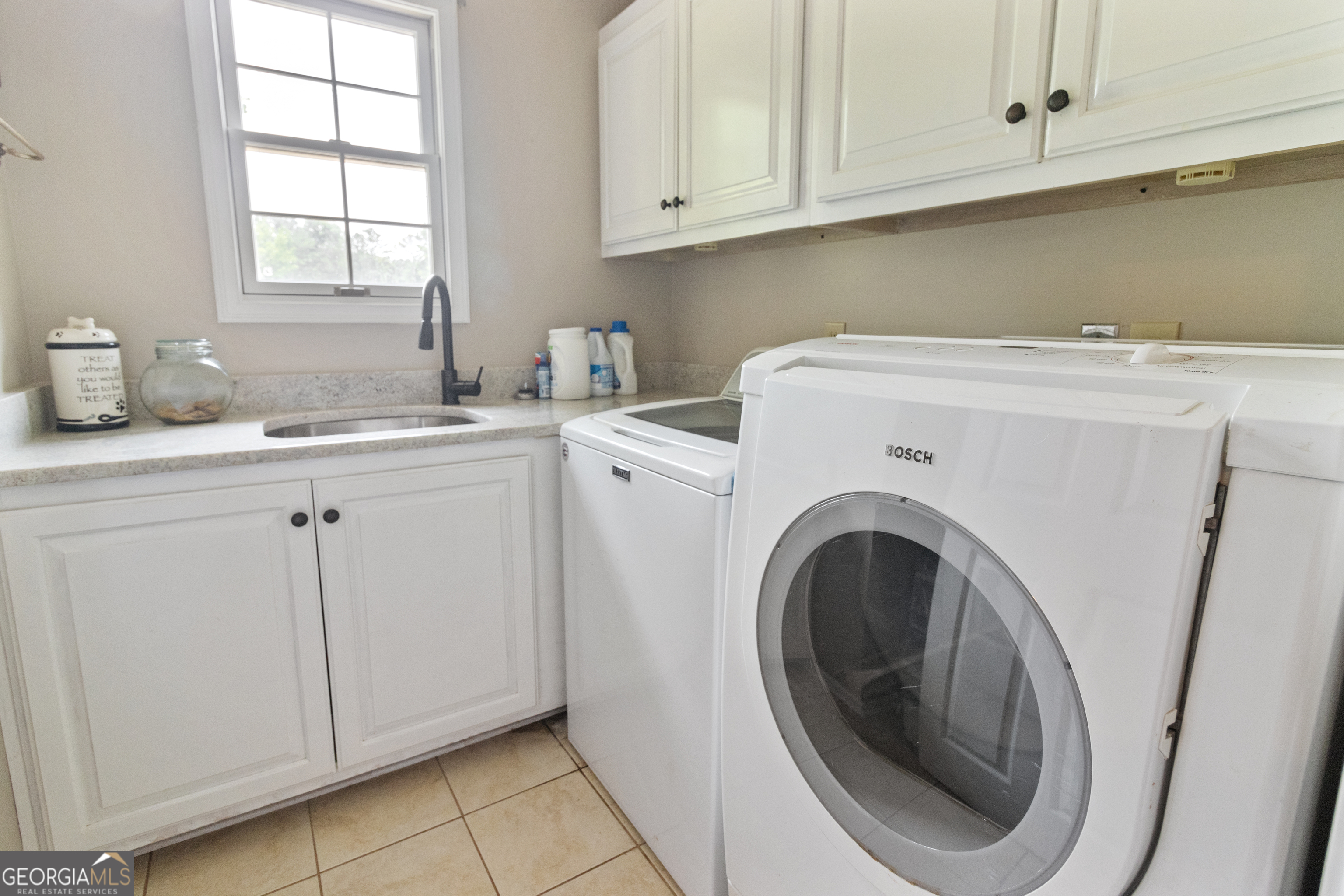 3890 Newnan Road Williamson, GA 30292 - Photo 41 of 57 a utility room with sink dryer and washer