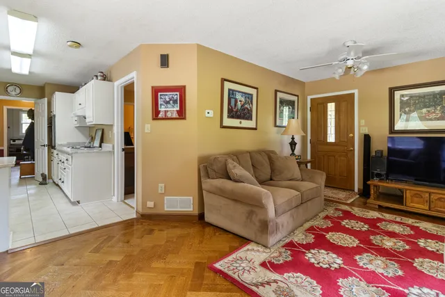 a kitchen with a sink window and cabinets