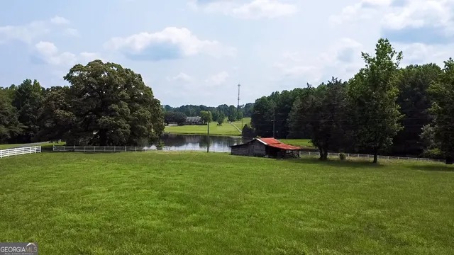 a view of a lake and trees in the background