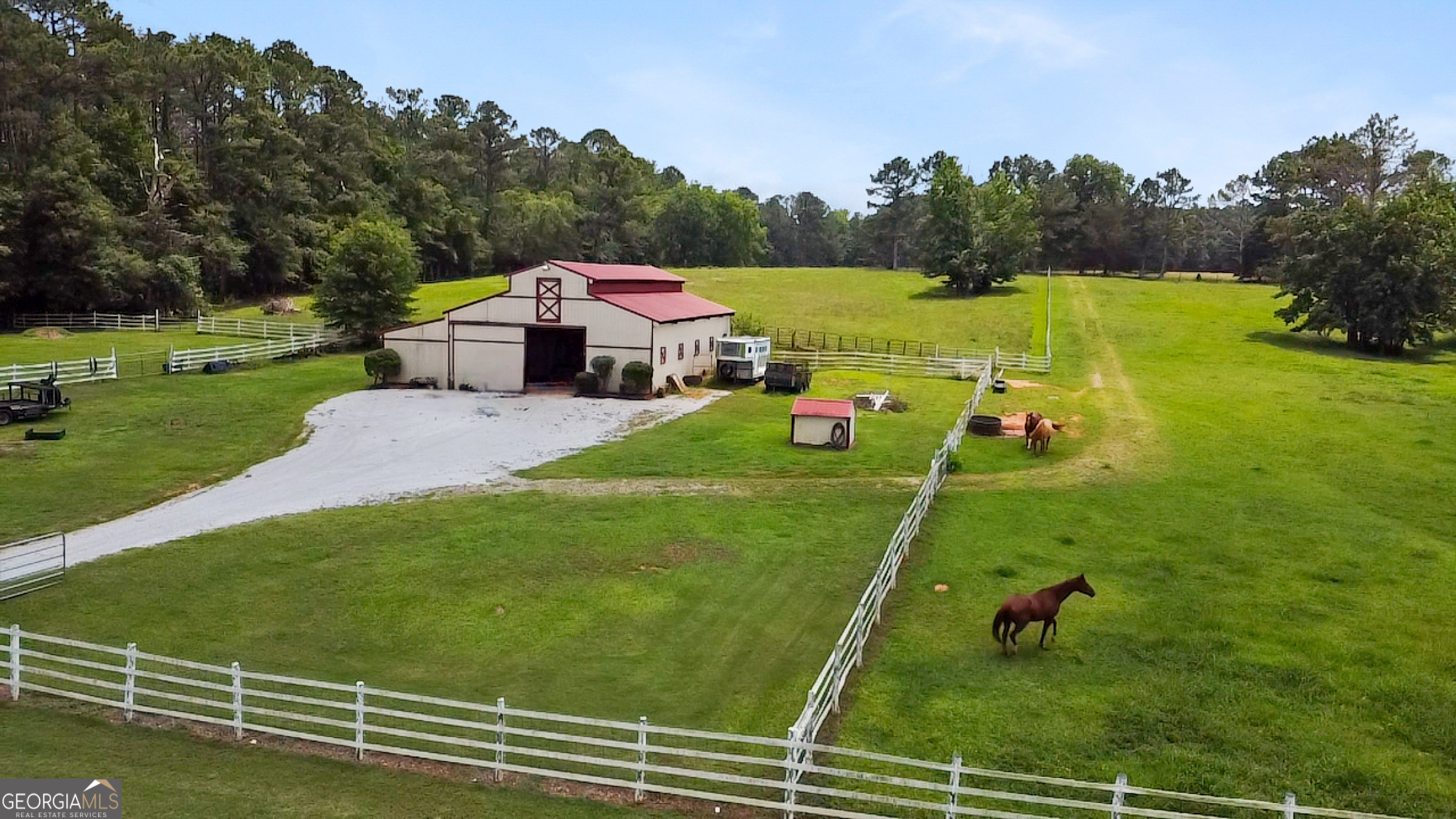 3890 Newnan Road Williamson, GA 30292 - Photo 53 of 57 a view of a white house with a big yard