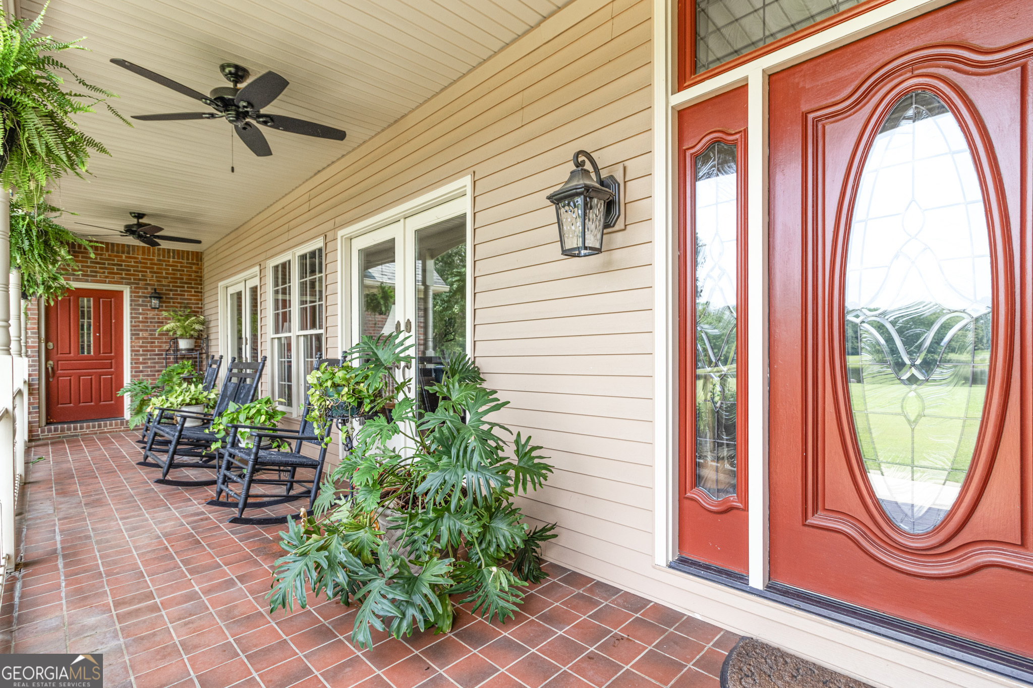 3890 Newnan Road Williamson, GA 30292 - Photo 7 of 57 a front view of a house with garden