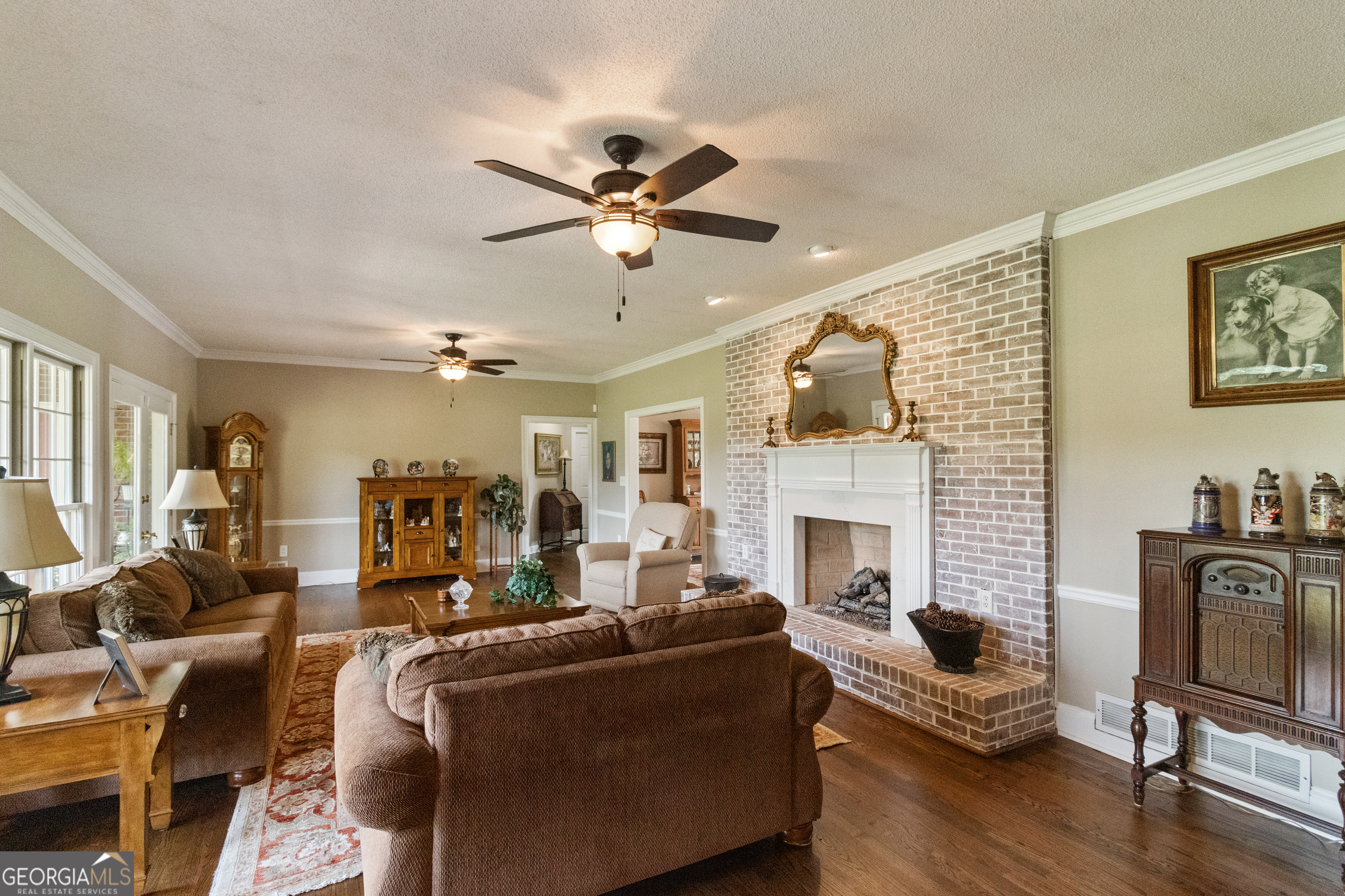 3890 Newnan Road Williamson, GA 30292 - Photo 10 of 57 a living room with furniture and a fireplace