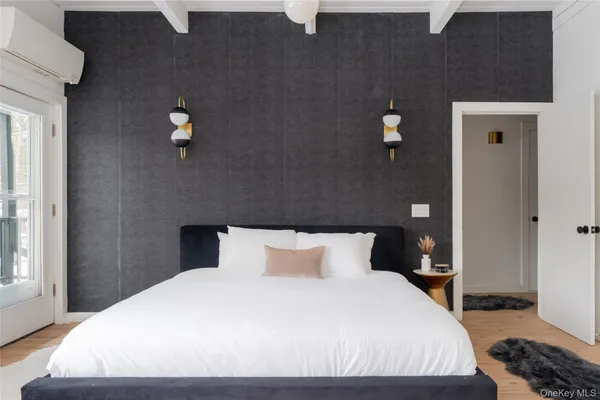 a bedroom with a bed and window