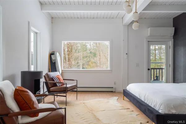 a bedroom with a bed and chair