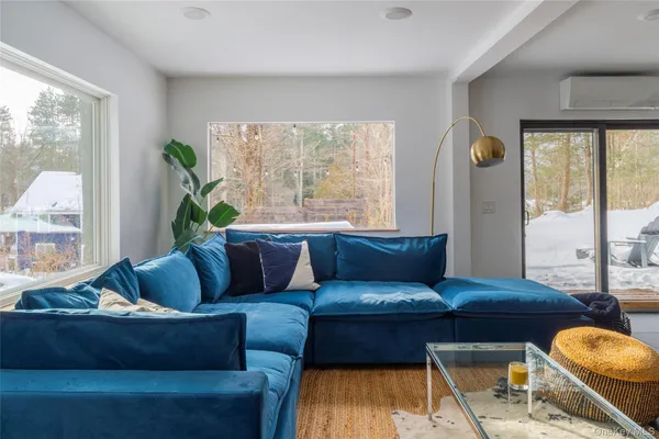 a living room with furniture and a large window