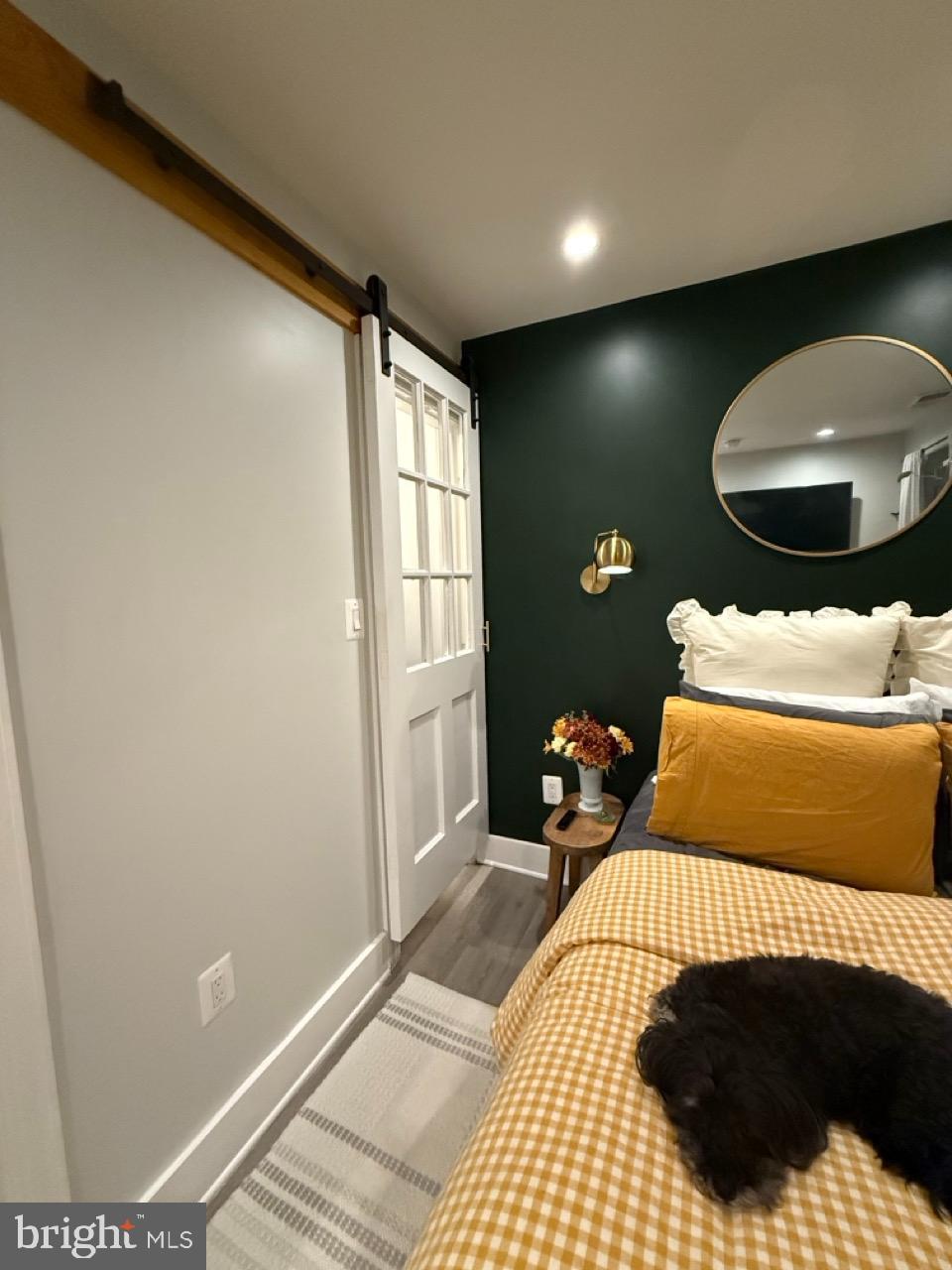 625 Park Road Northwest, Unit C8 Washington, DC 20010 - Photo 23 of 35 a bedroom with a bed and a mirror