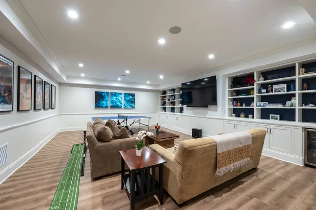 a living room with patio furniture and a fireplace