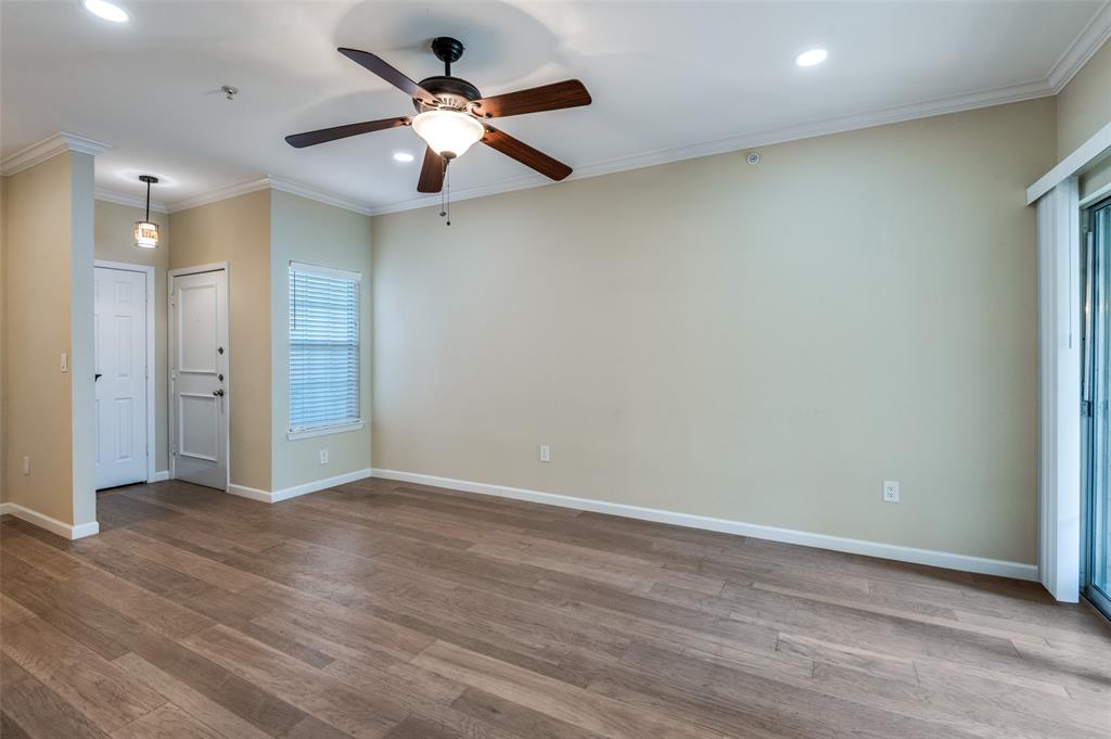 2601 Preston Road, Unit 3103 Plano, TX 75093 - Photo 4 of 30 Ceiling fan with light fixture in Living area. Beautiful Hickory Hardwood flooring.