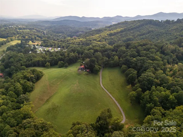 a front view of a house with a big yard