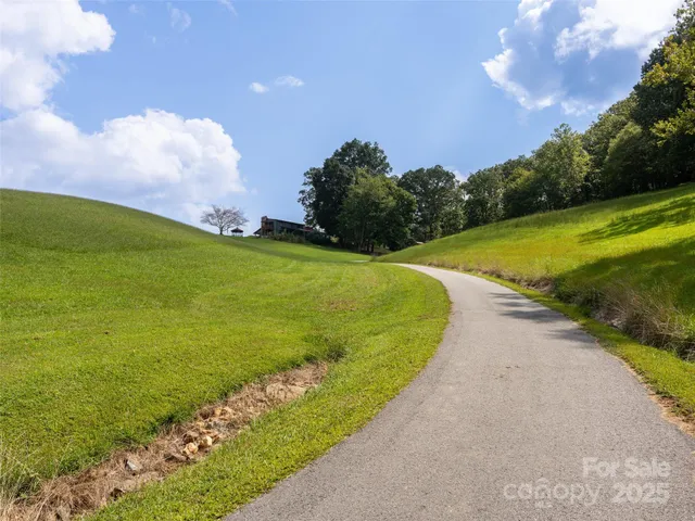 a view of a green field with clear sky