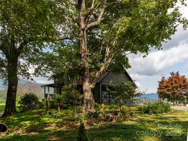 a view of house with yard