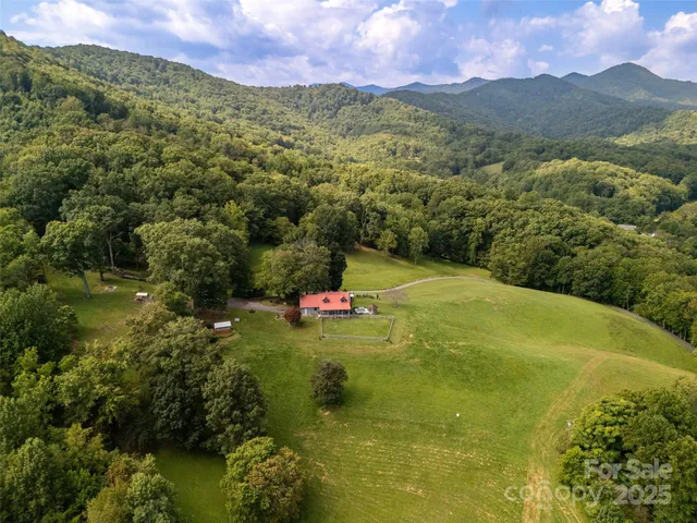 a view of a town with mountains in the background
