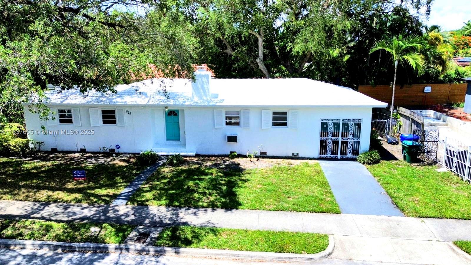 a view of front of house with a yard
