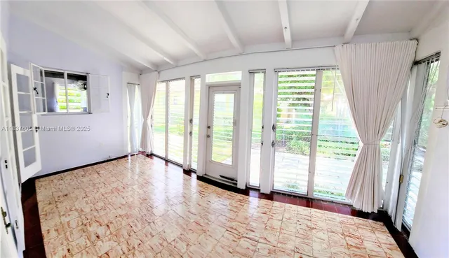 a view of an empty room and window