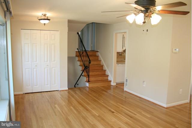 6021 Craft Road Alexandria, VA 22310 - Photo 2 of 30 a view of a livingroom with wooden floor and staircase