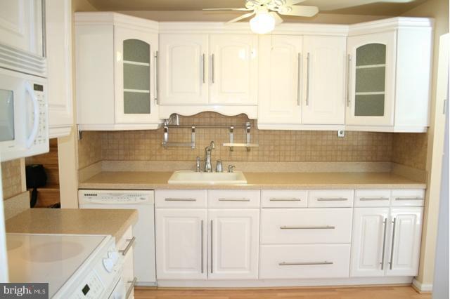 6021 Craft Road Alexandria, VA 22310 - Photo 12 of 30 a kitchen with stainless steel appliances granite countertop a sink and cabinets