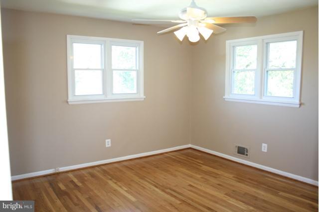 6021 Craft Road Alexandria, VA 22310 - Photo 20 of 30 wooden floor in an empty room with a window