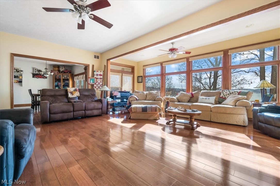 4280 Newbury Road Little Hocking, OH 45742 - Photo 11 of 41 Living room with ceiling fan and dark hardwood / wood-style flooring