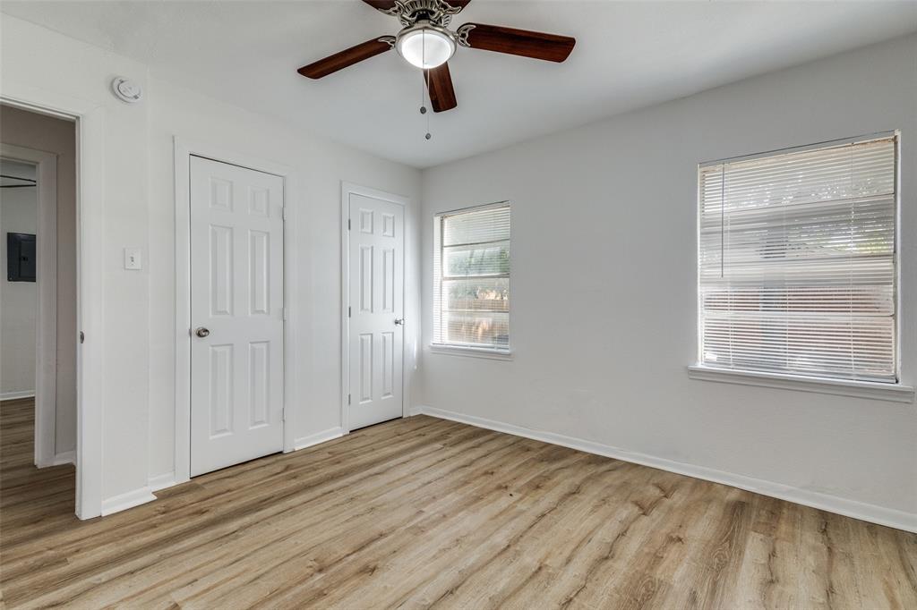 217 Ridgeway Avenue Azle, TX 76020 - Photo 14 of 27 a view of empty room with wooden floor and fan