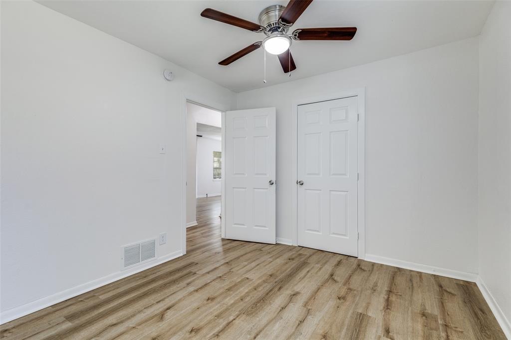 217 Ridgeway Avenue Azle, TX 76020 - Photo 18 of 27 wooden floor in an empty room