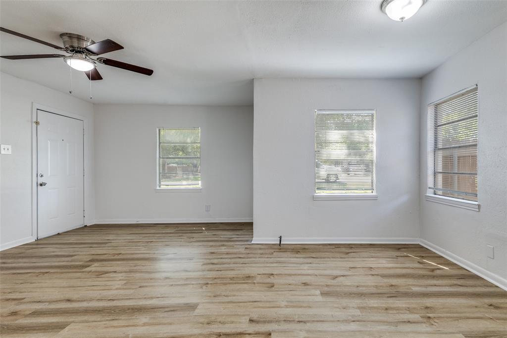 217 Ridgeway Avenue Azle, TX 76020 - Photo 6 of 27 a view of empty room with wooden floor and fan