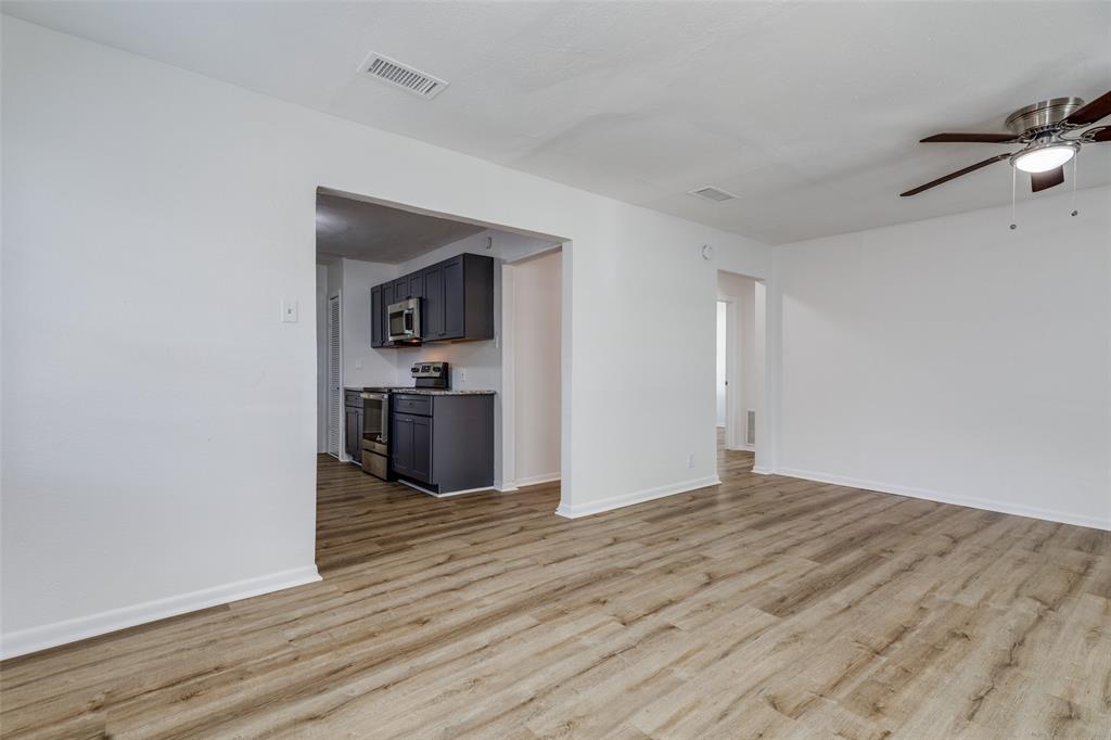 217 Ridgeway Avenue Azle, TX 76020 - Photo 8 of 27 a view of kitchen with wooden floor