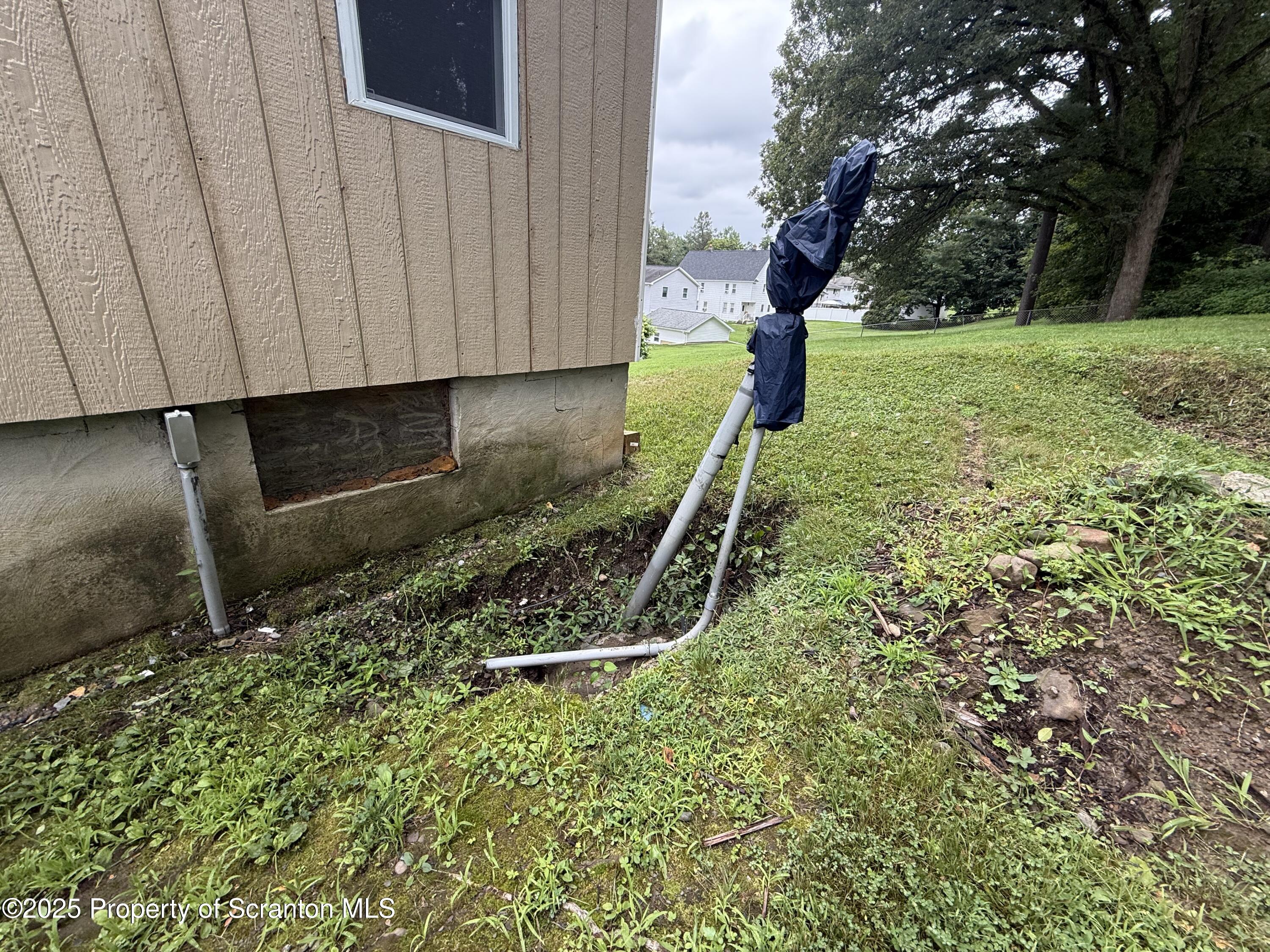 1002 Ridge Street, Unit L 38 Olyphant, PA 18447 - Photo 13 of 15 a backyard of a house with lots of green space