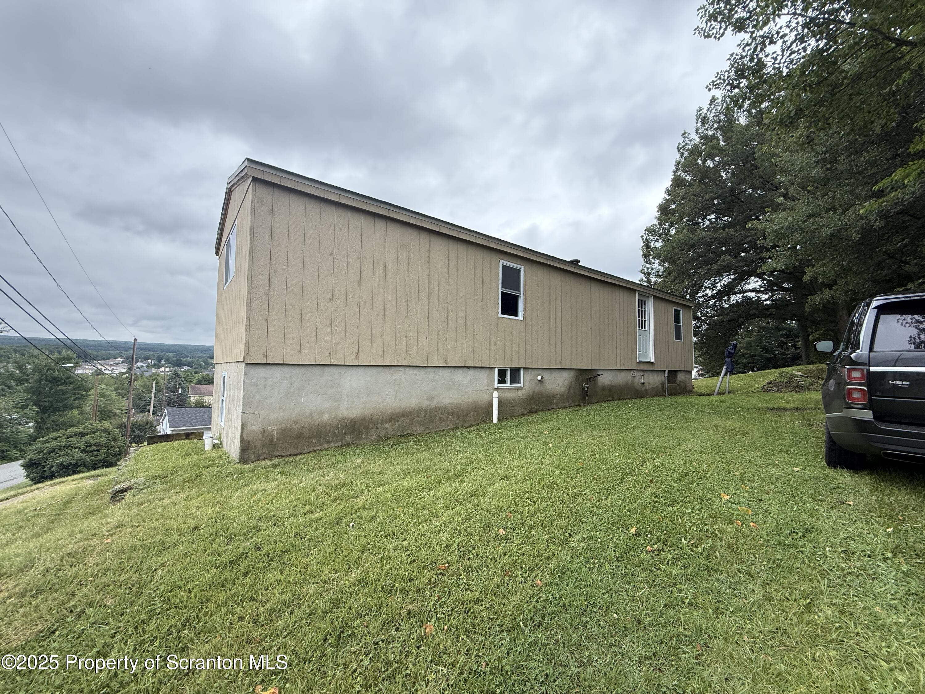 1002 Ridge Street, Unit L 38 Olyphant, PA 18447 - Photo 14 of 15 a backyard of a house with lots of green space
