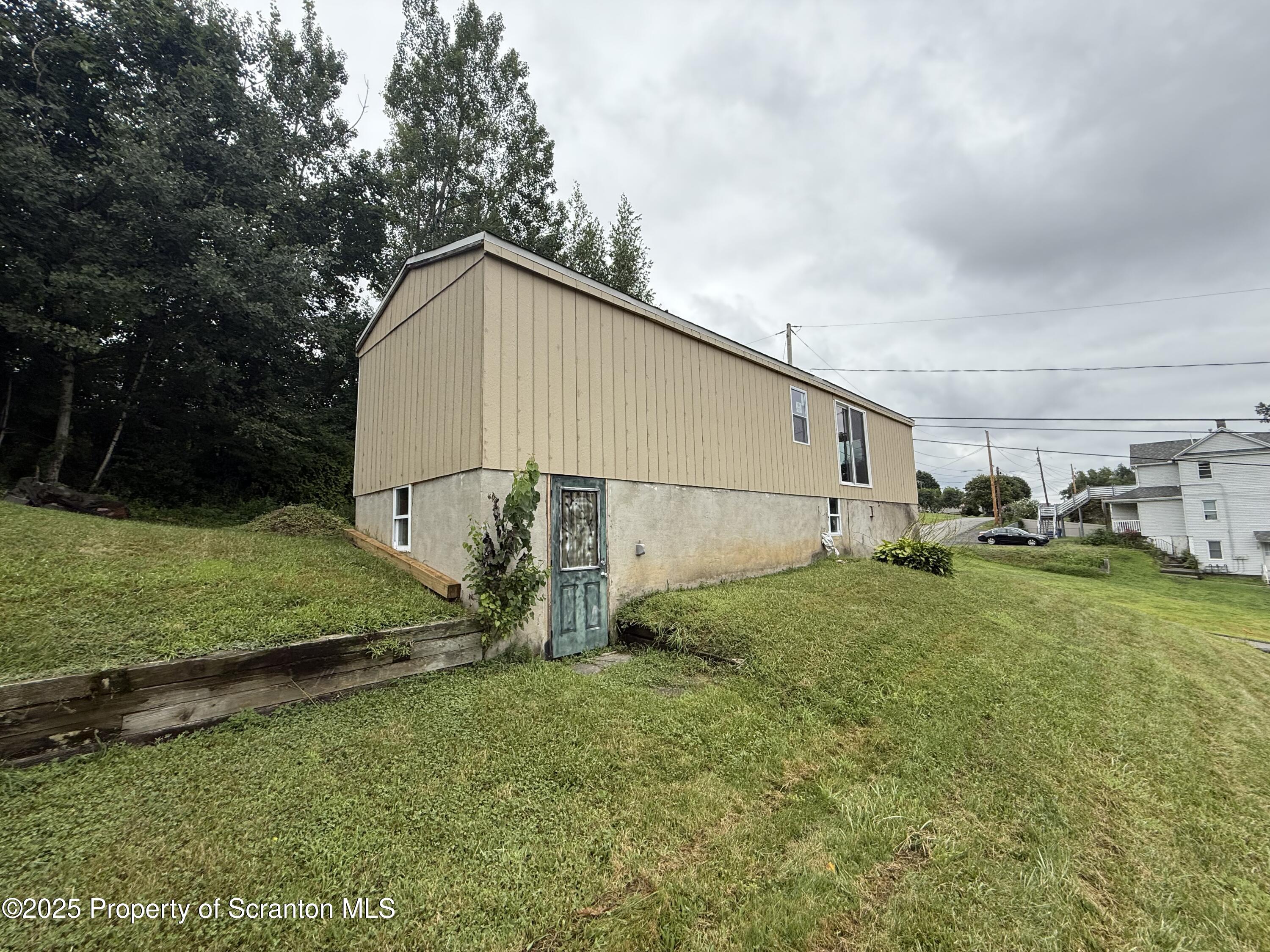 1002 Ridge Street, Unit L 38 Olyphant, PA 18447 - Photo 3 of 15 a view of backyard with green space