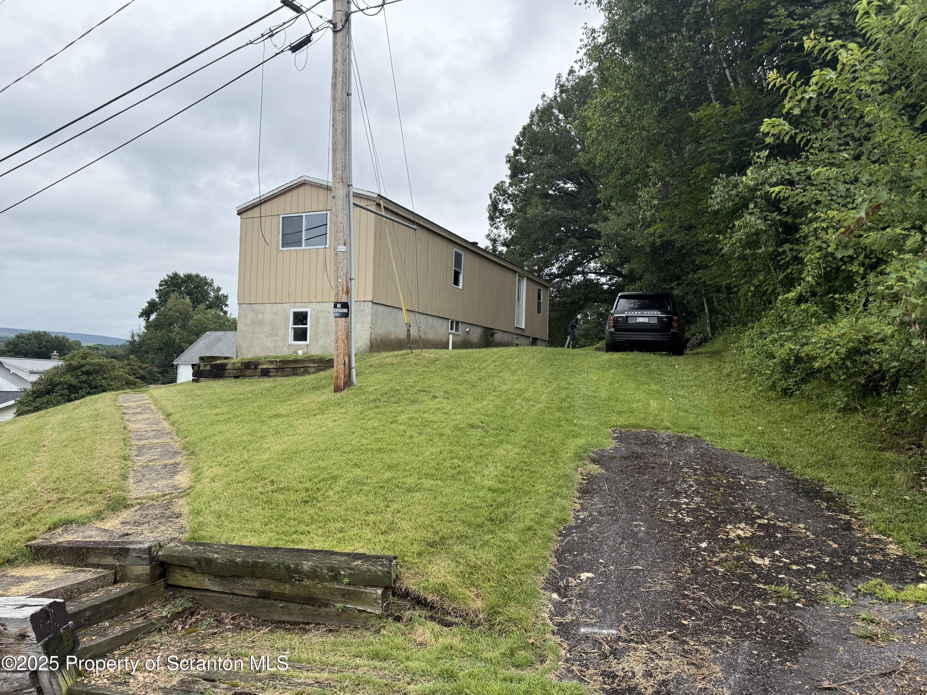 1002 Ridge Street, Unit L 38 Olyphant, PA 18447 - Photo 5 of 15 a view of a back yard of the house