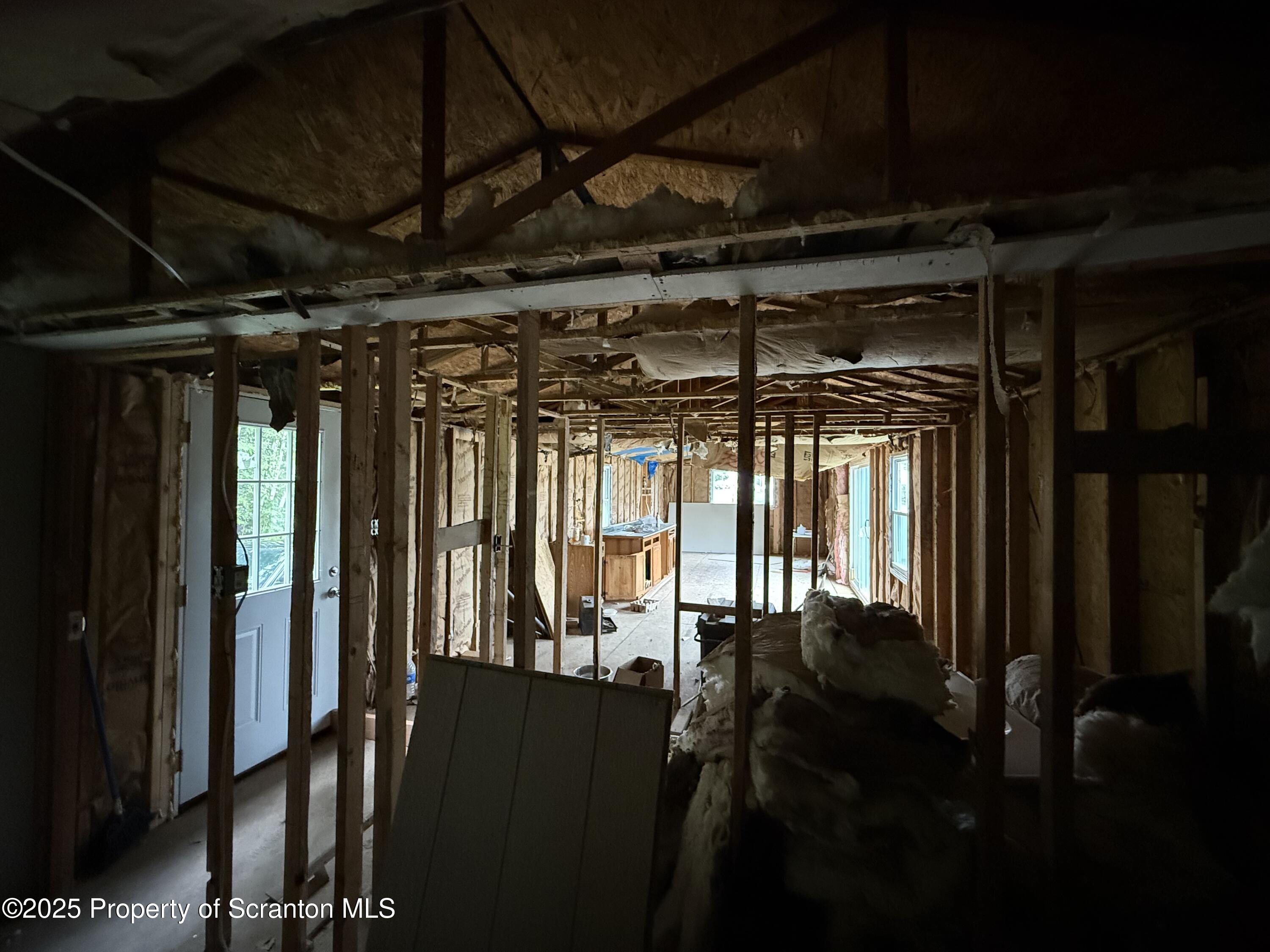 1002 Ridge Street, Unit L 38 Olyphant, PA 18447 - Photo 8 of 15 a view of a hallway with wooden floor