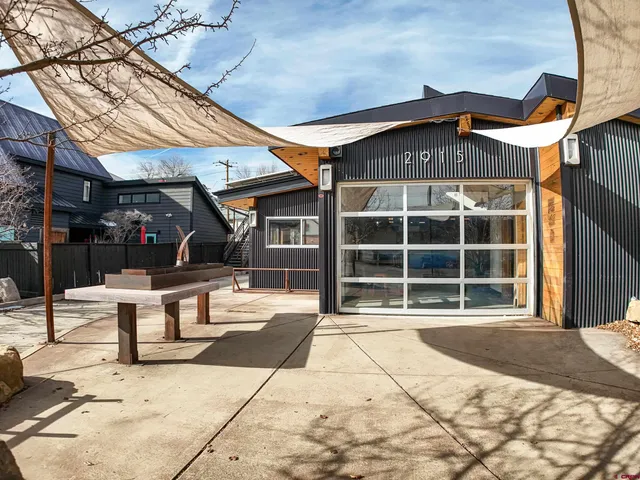 a front view of a building with sitting area