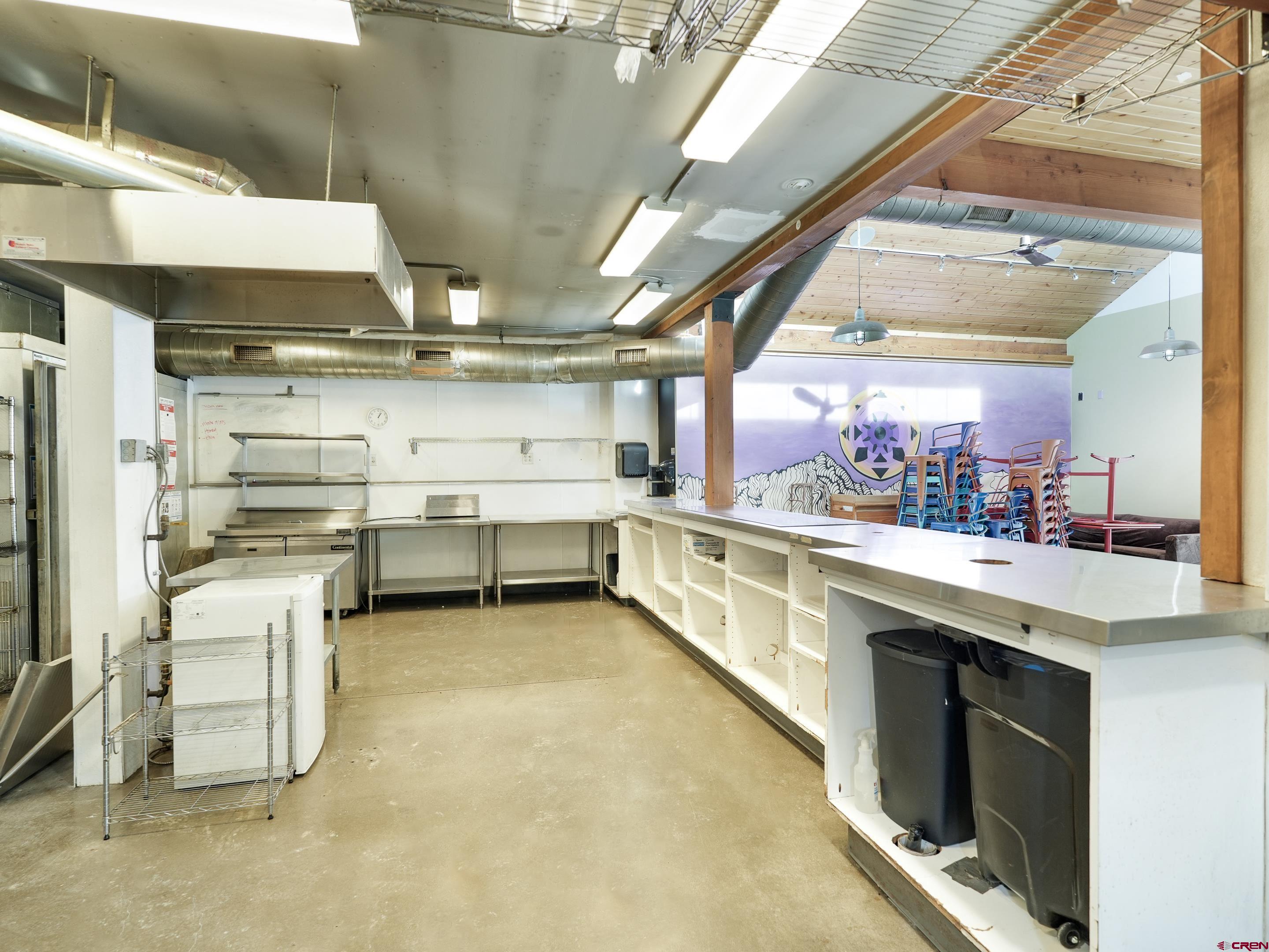 2915 Main Avenue Durango, CO 81301 - Photo 9 of 14 a kitchen with stainless steel appliances granite countertop a sink and white cabinets