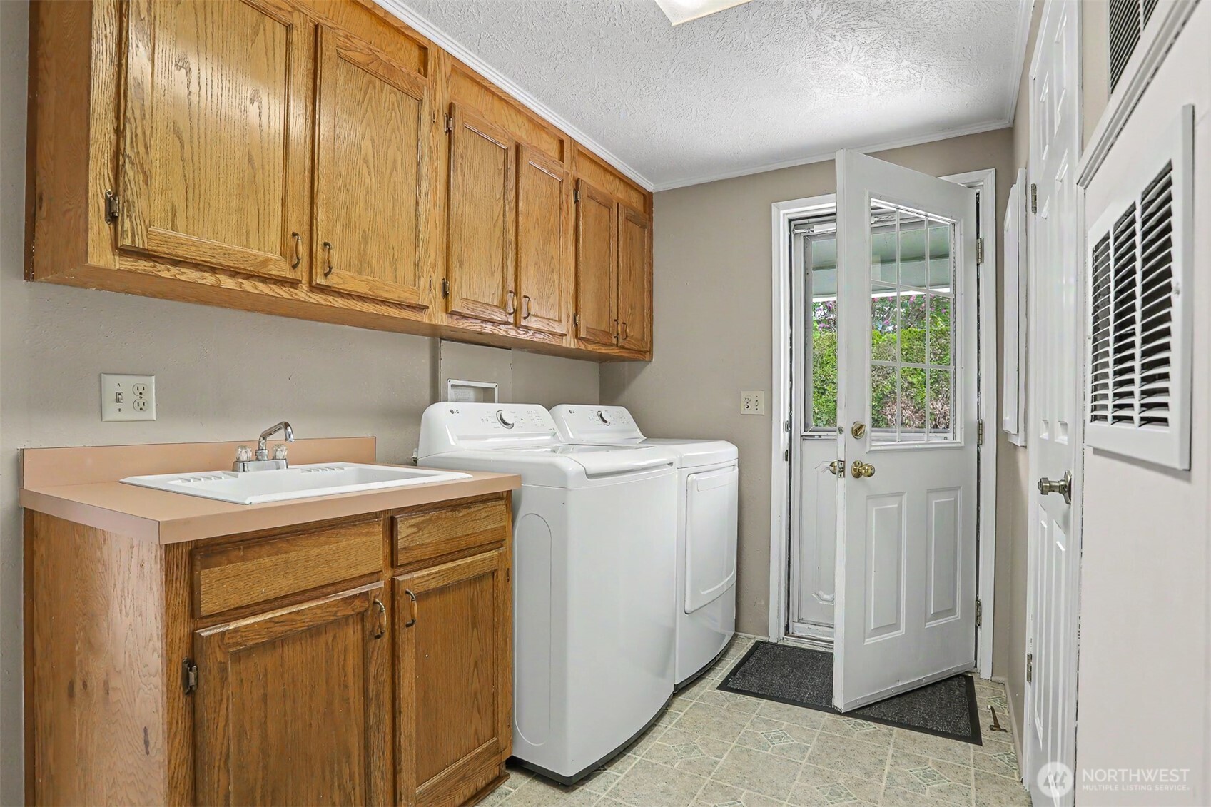 905 243rd Street Southwest Bothell, WA 98021 - Photo 29 of 37 a utility room with dryer and washer