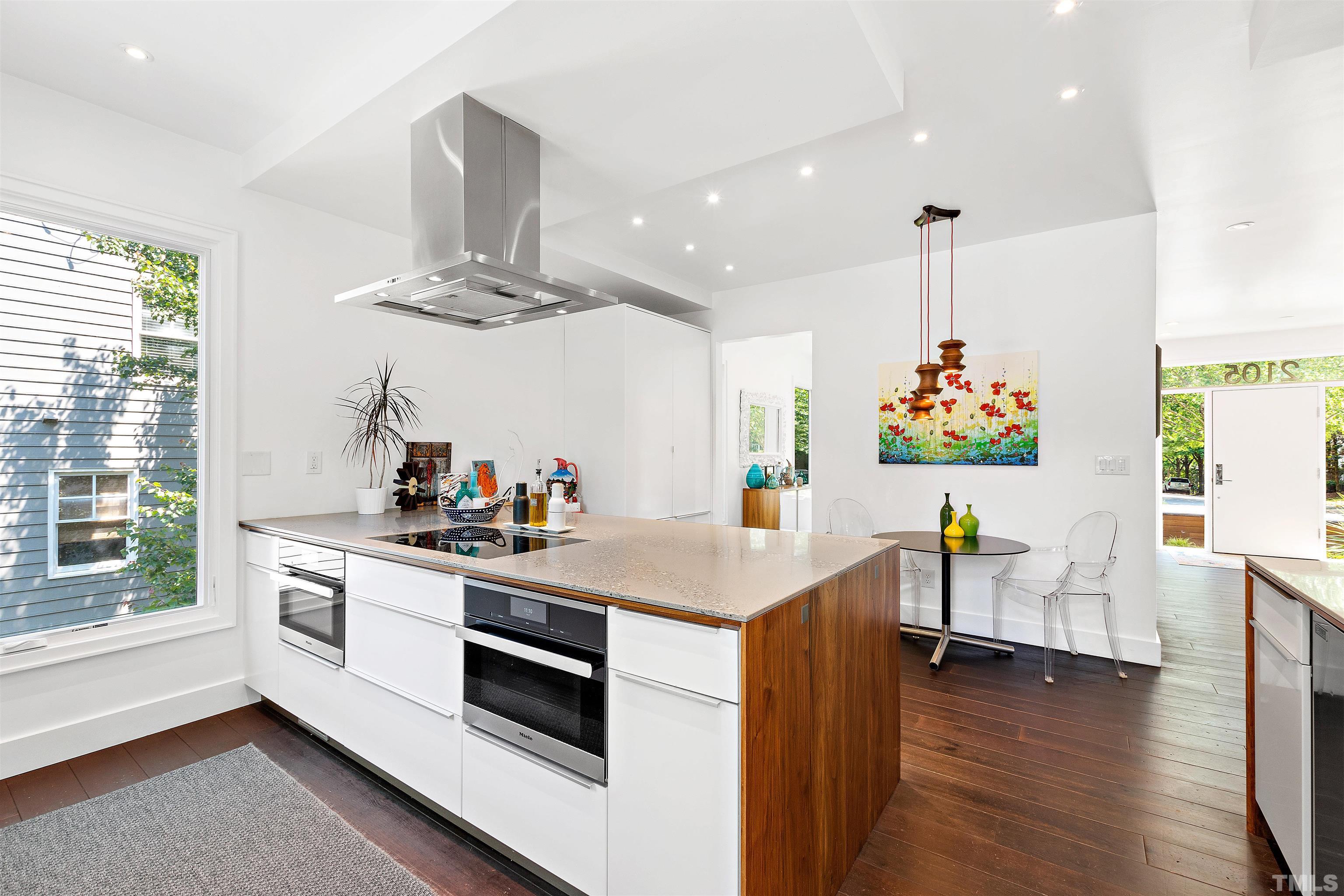 2105 Pine Drive Raleigh, NC 27608 - Photo 11 of 54 a kitchen with a sink and wooden floor
