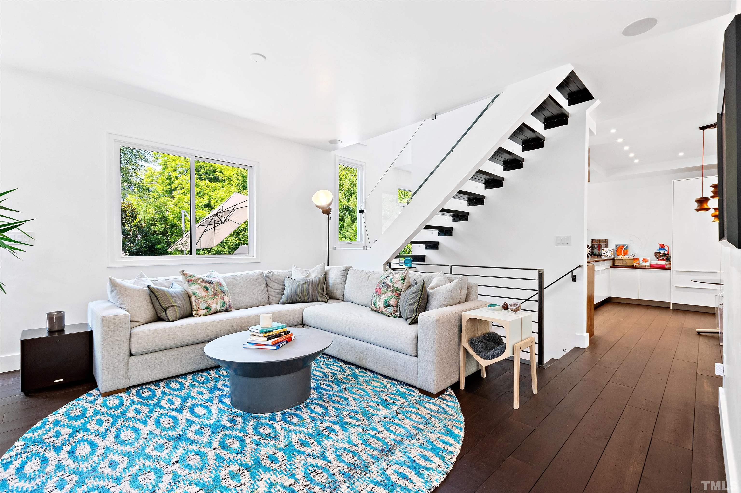 2105 Pine Drive Raleigh, NC 27608 - Photo 16 of 54 a living room with furniture and a large window