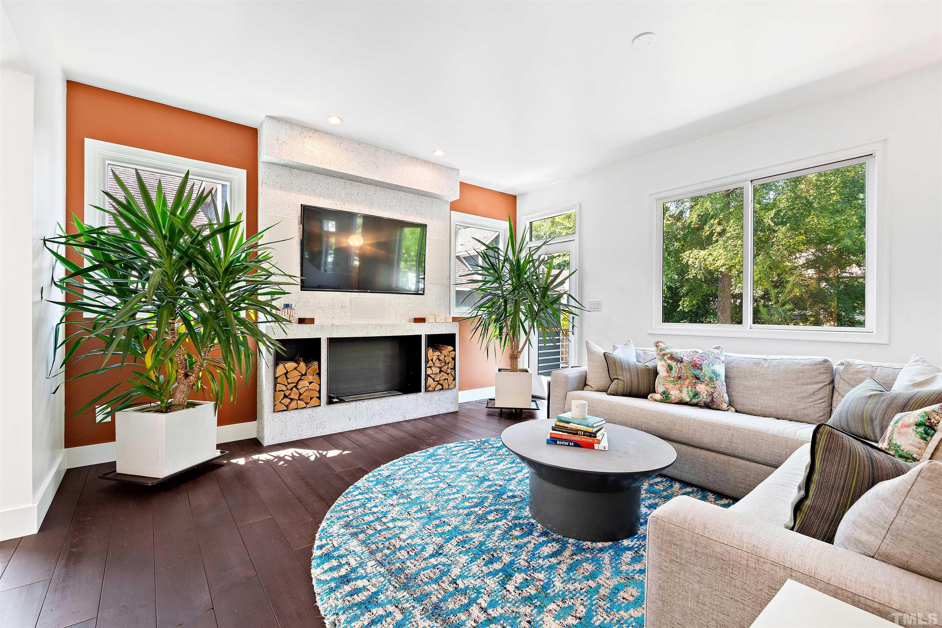 2105 Pine Drive Raleigh, NC 27608 - Photo 17 of 54 a living room with furniture a fireplace and a potted plant