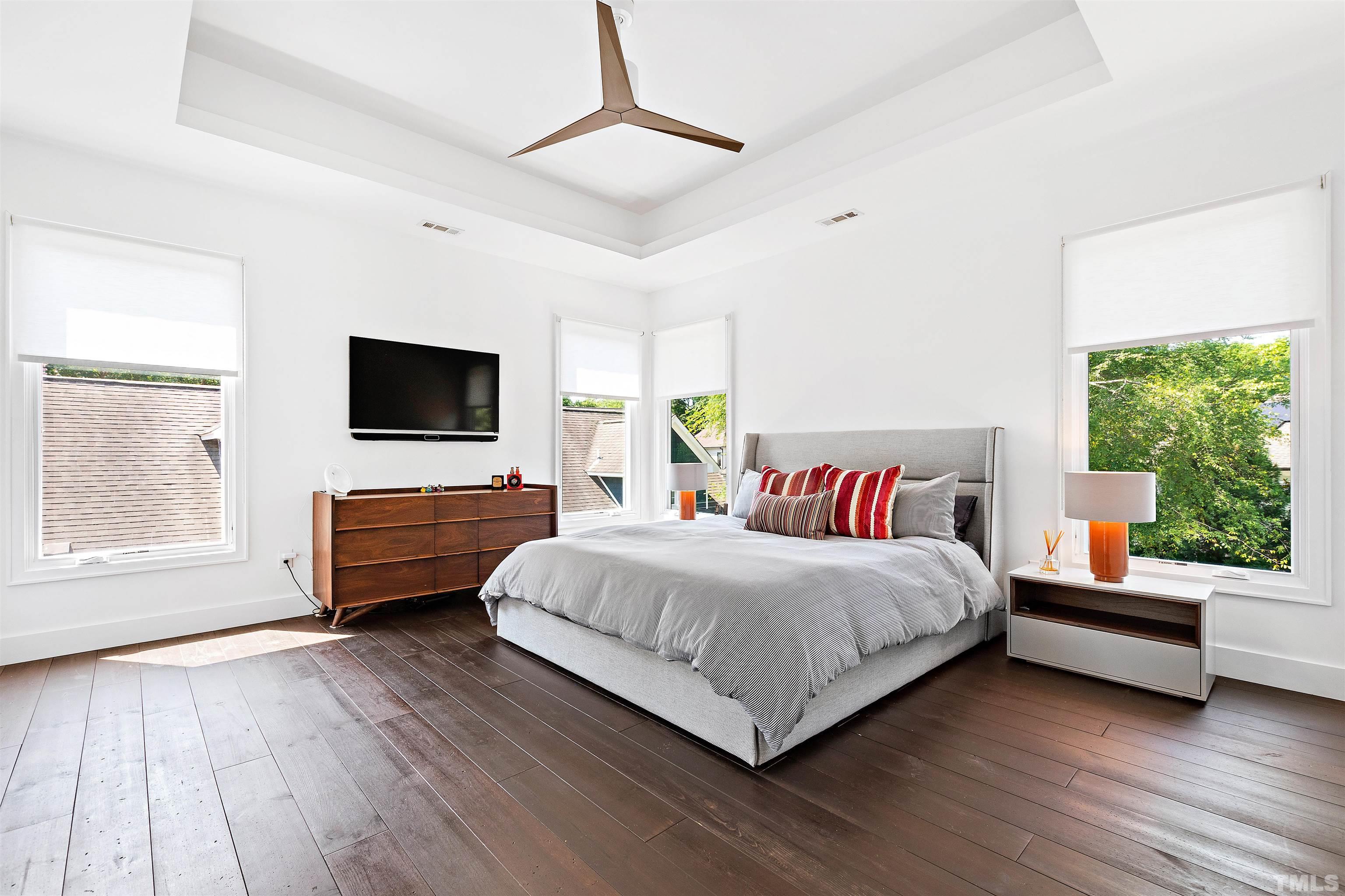 2105 Pine Drive Raleigh, NC 27608 - Photo 21 of 54 a bedroom with a bed and a flat screen tv