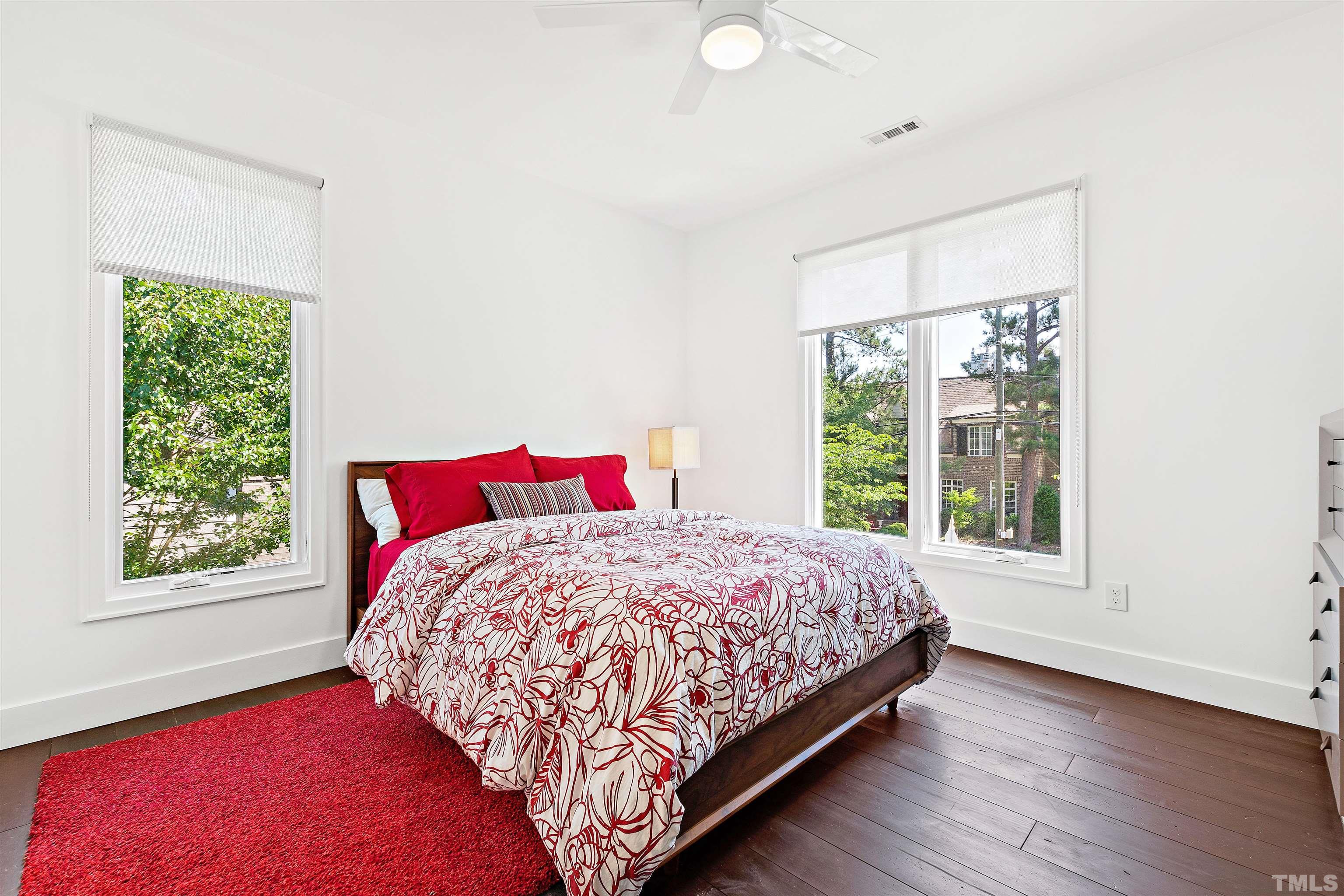 2105 Pine Drive Raleigh, NC 27608 - Photo 25 of 54 a bedroom with a bed and a window