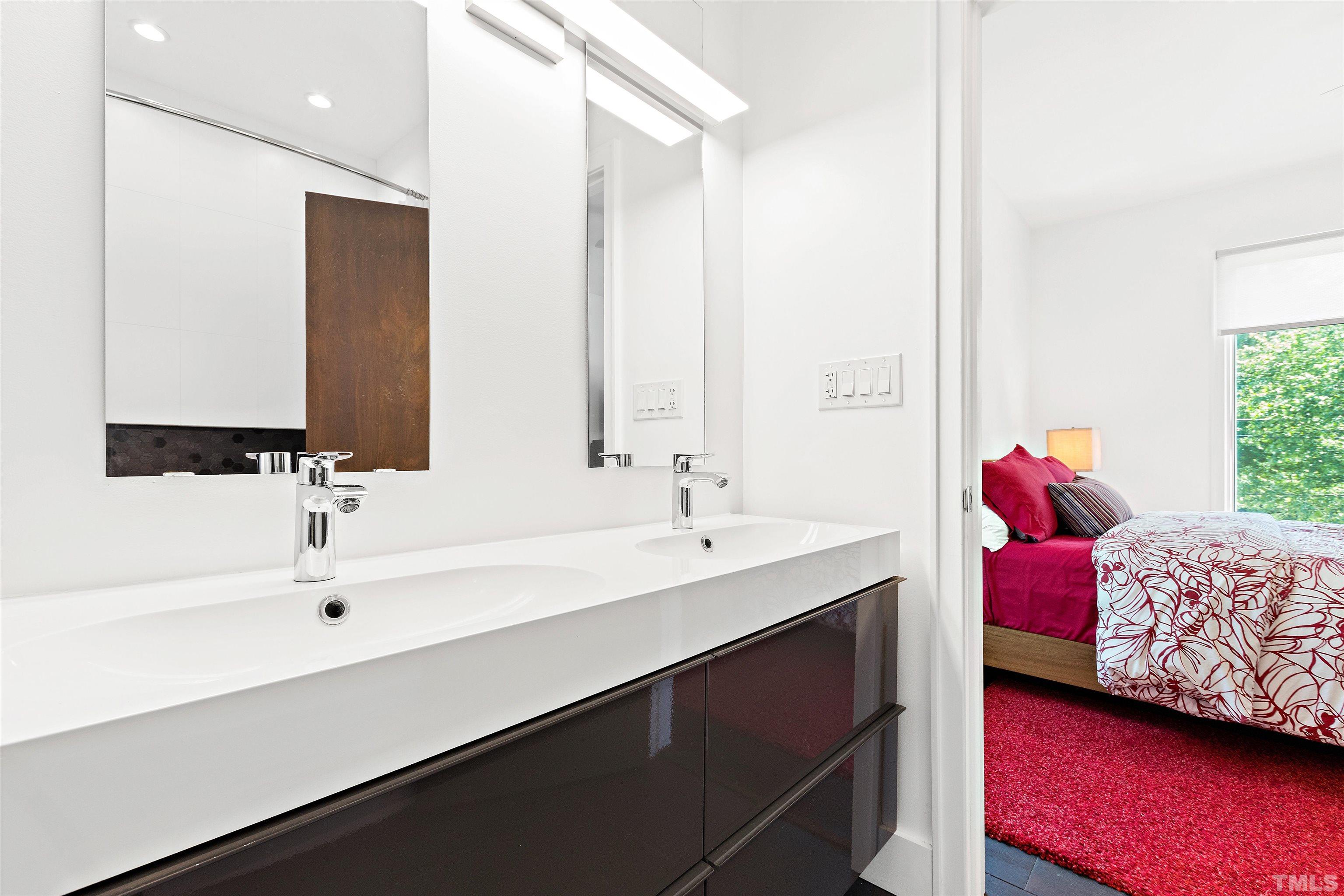 2105 Pine Drive Raleigh, NC 27608 - Photo 27 of 54 a bathroom with a sink and a mirror