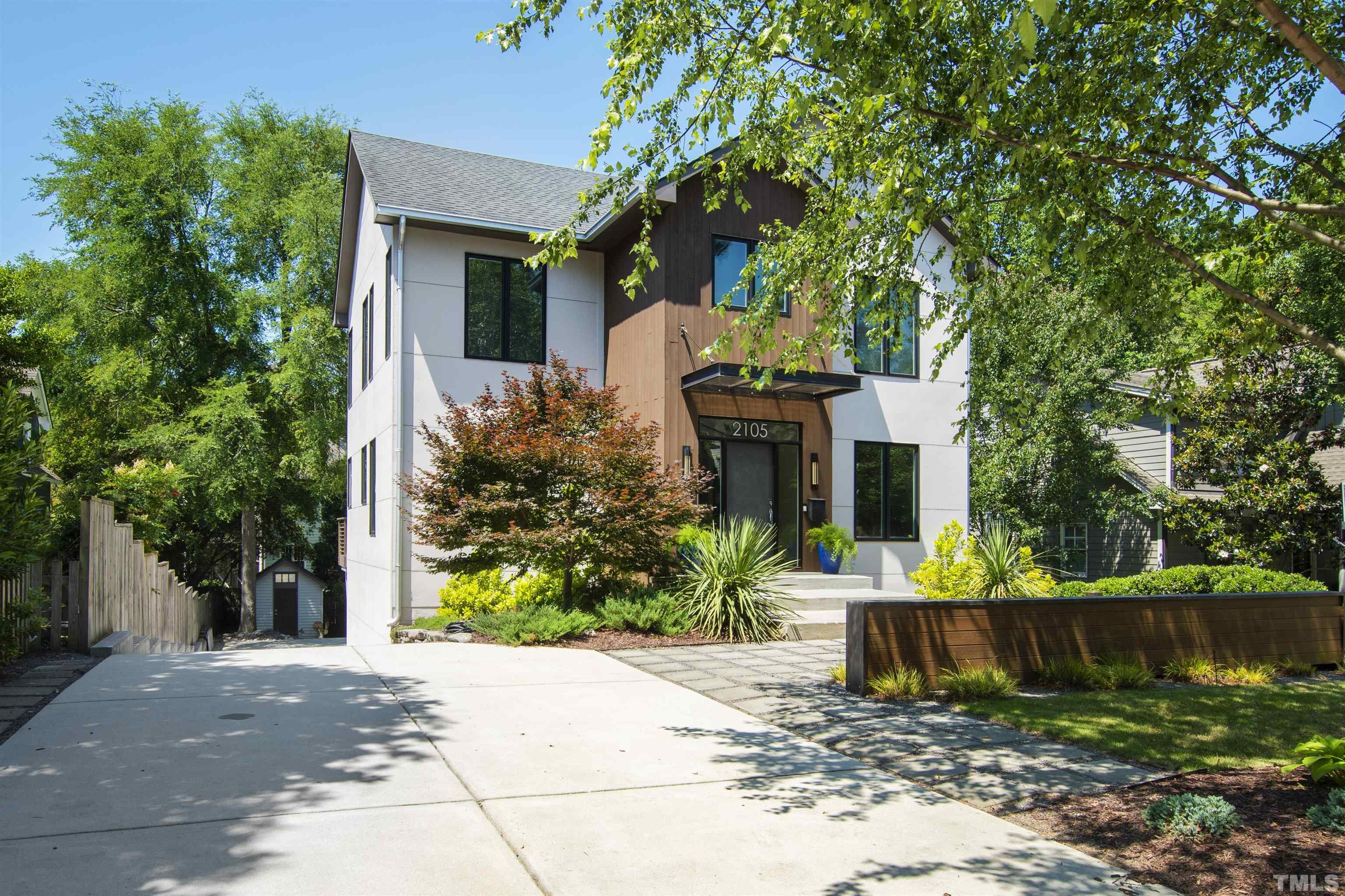 2105 Pine Drive Raleigh, NC 27608 - Photo 3 of 54 a front view of a house with garden