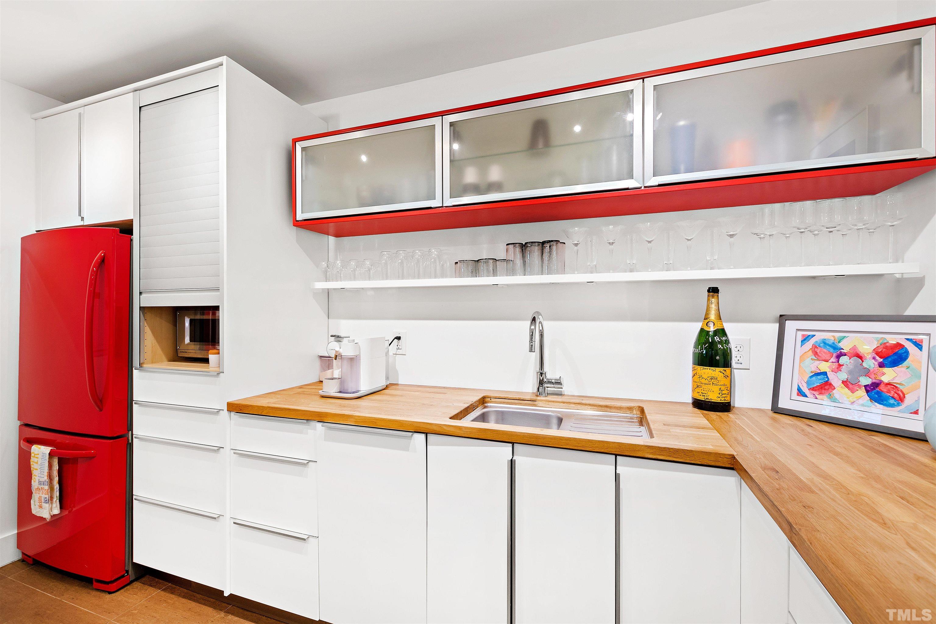 2105 Pine Drive Raleigh, NC 27608 - Photo 33 of 54 a kitchen with stainless steel appliances granite countertop a sink and a microwave