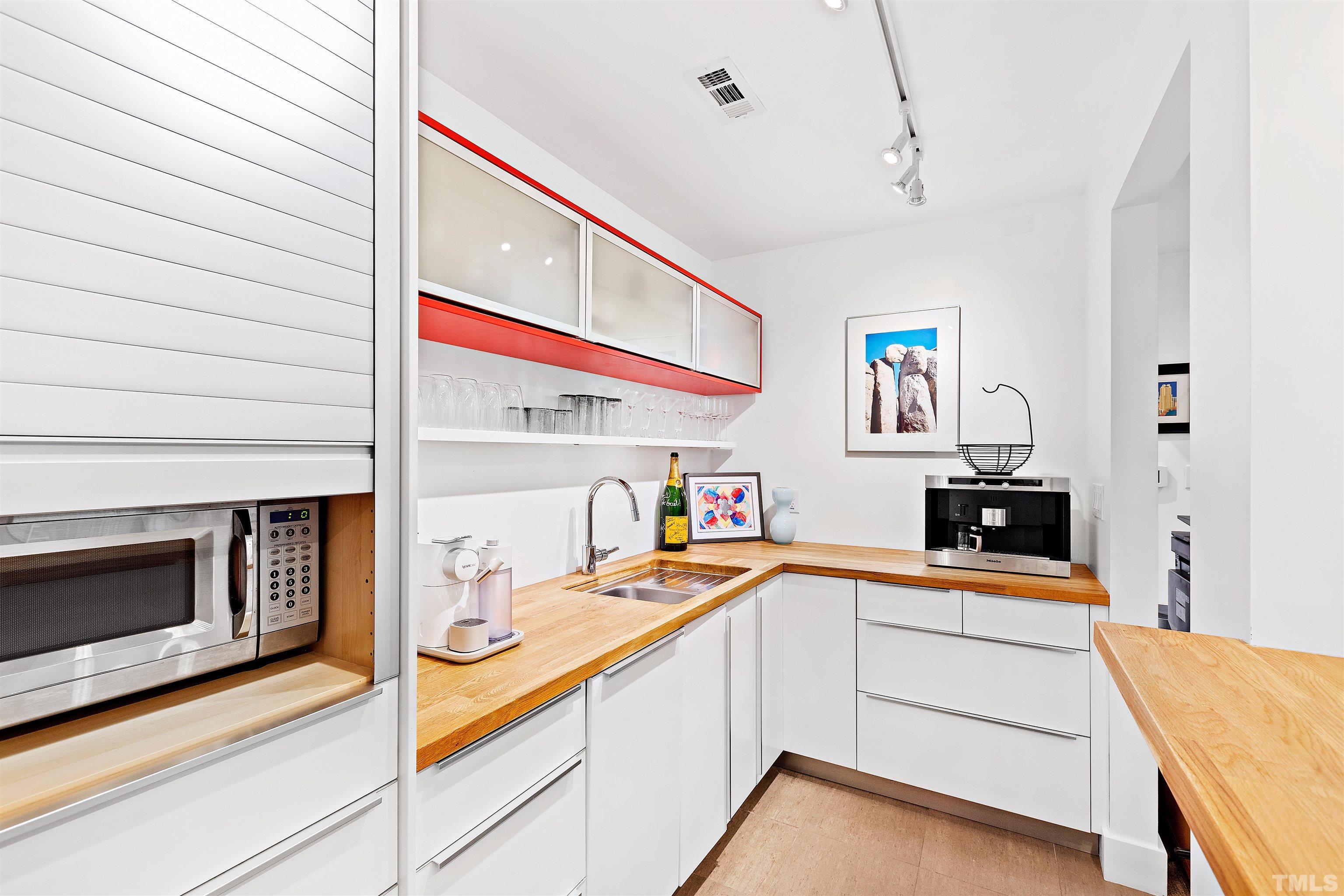 2105 Pine Drive Raleigh, NC 27608 - Photo 34 of 54 a kitchen with stainless steel appliances kitchen island granite countertop a sink and cabinets