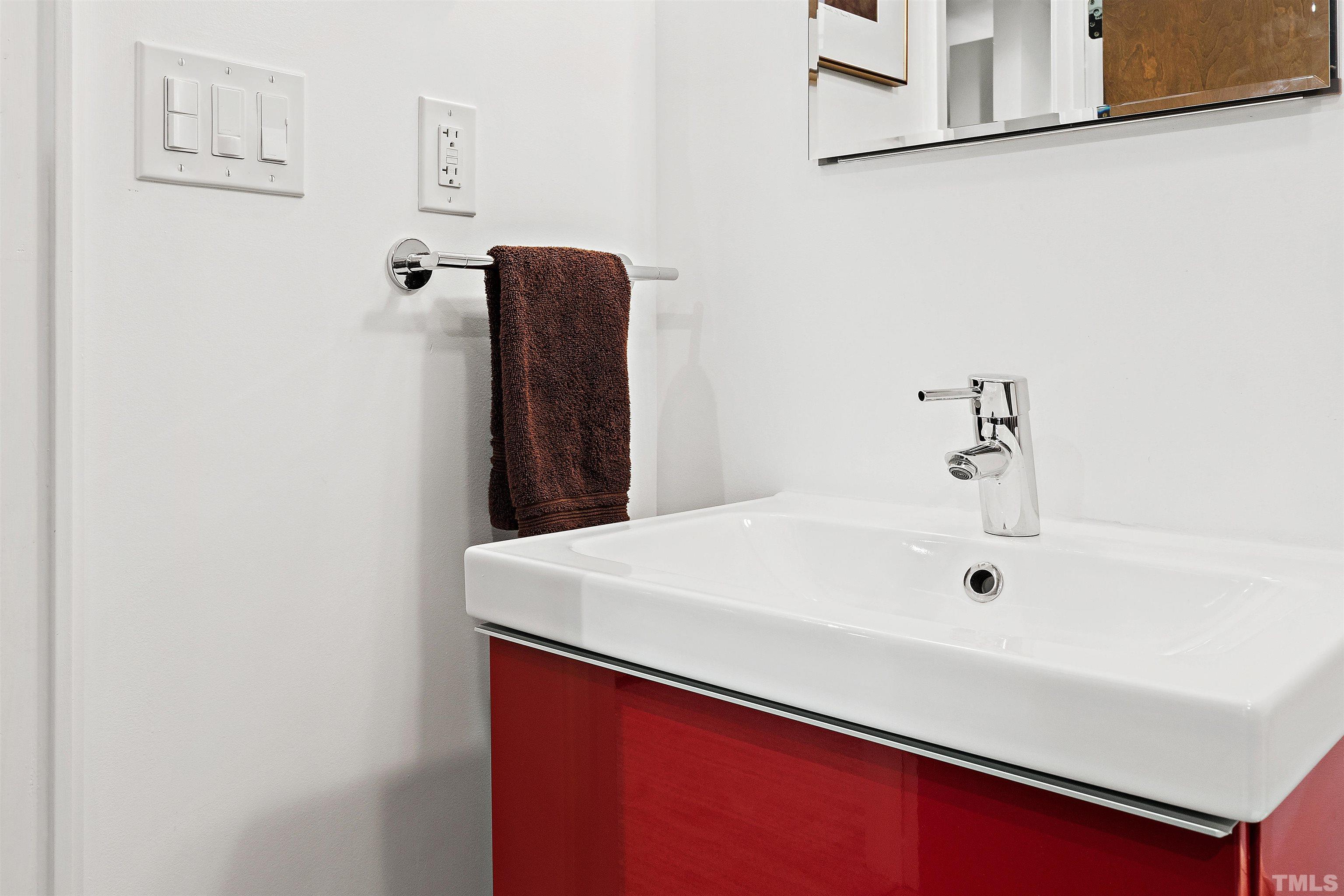 2105 Pine Drive Raleigh, NC 27608 - Photo 36 of 54 a bathroom with a sink and mirror