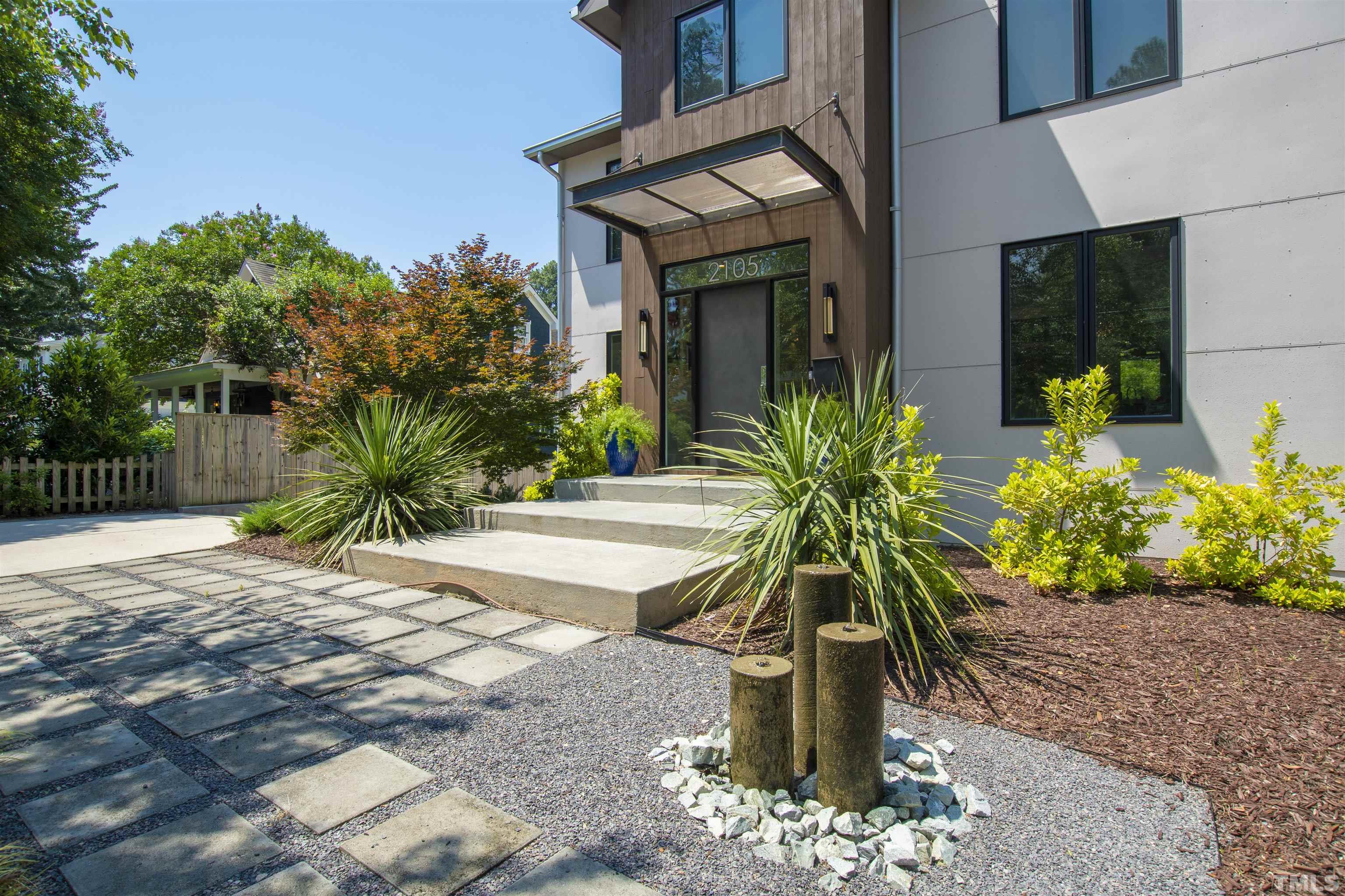 2105 Pine Drive Raleigh, NC 27608 - Photo 4 of 54 a vase of flowers sitting on a sidewalk