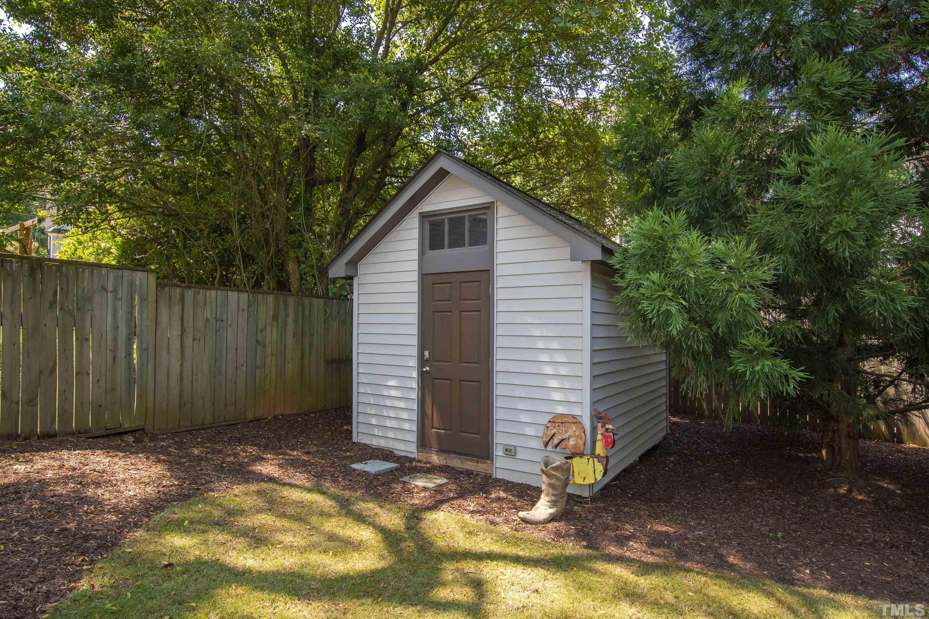 2105 Pine Drive Raleigh, NC 27608 - Photo 47 of 54 a view of backyard with tree and wooden fence