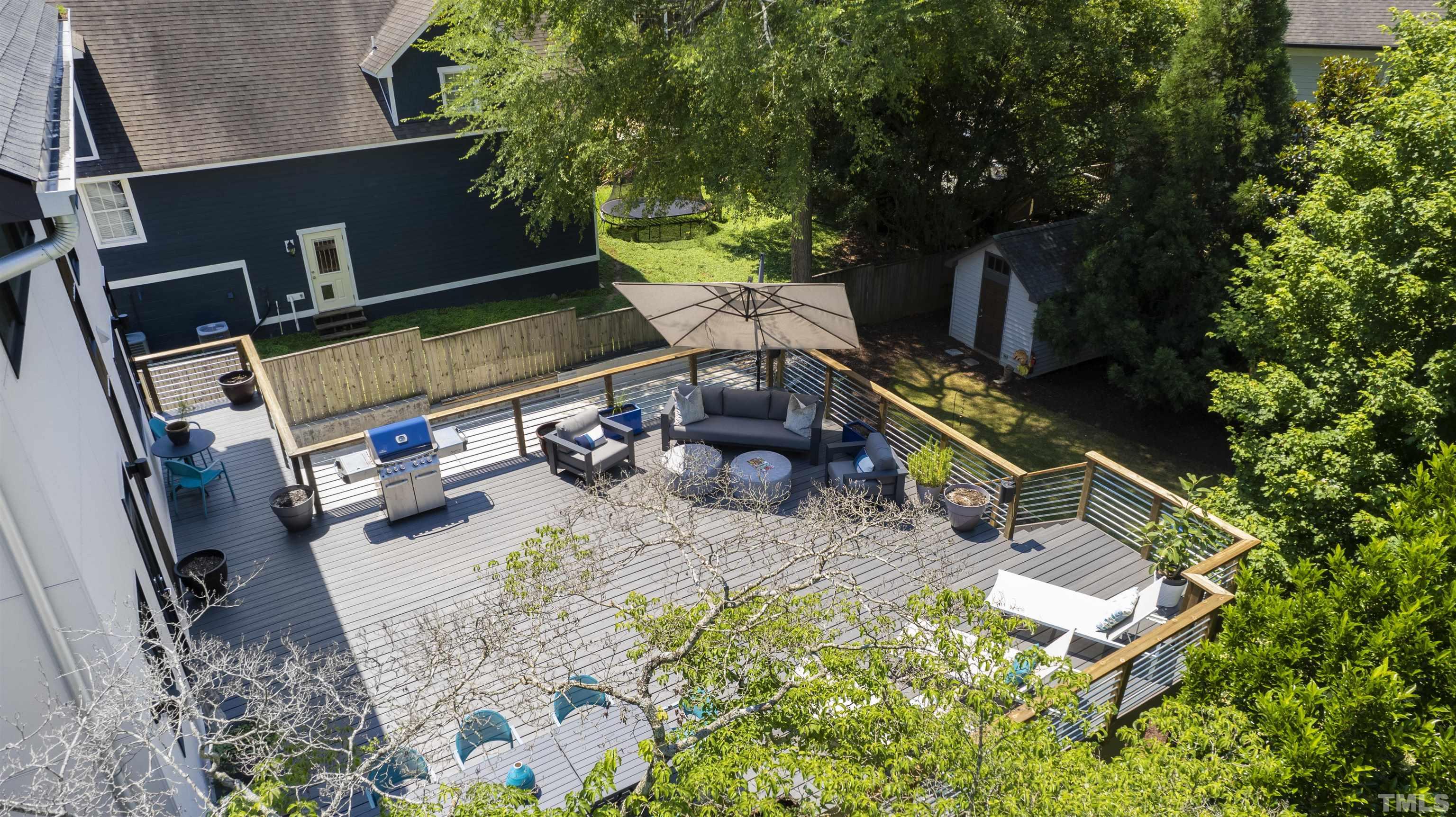 2105 Pine Drive Raleigh, NC 27608 - Photo 50 of 54 an aerial view of a house with backyard space and sitting area