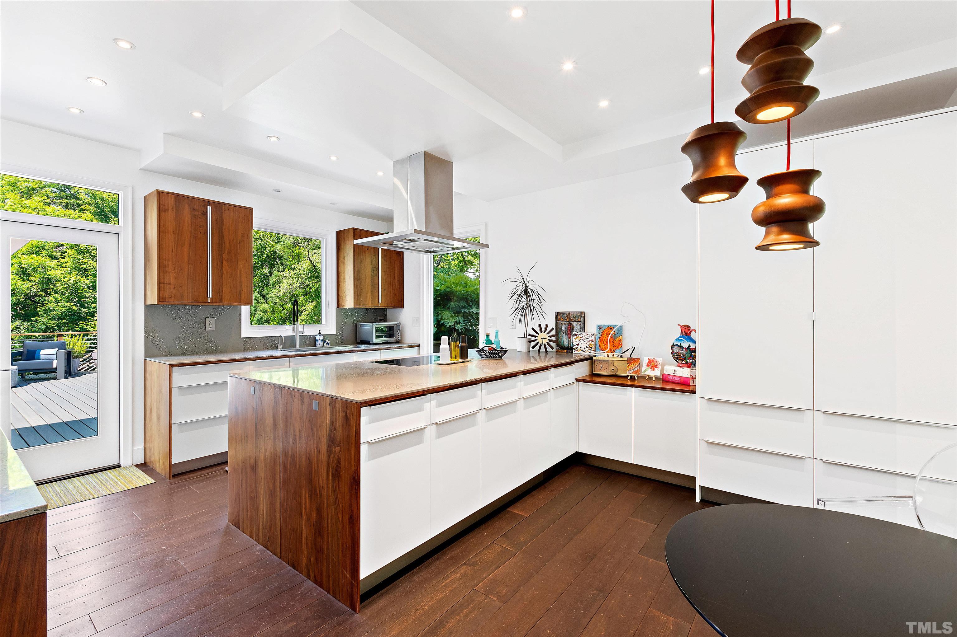 2105 Pine Drive Raleigh, NC 27608 - Photo 9 of 54 a kitchen with granite countertop white cabinets and white appliances