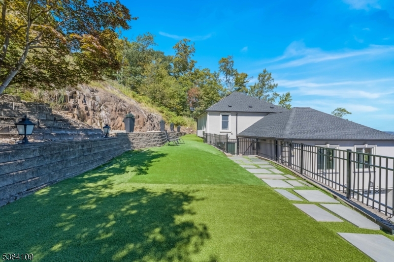 207 Eileen Drive Cedar Grove, NJ 07009 - Photo 23 of 26 a view of a house with a big yard and large trees