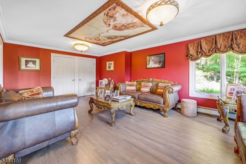 207 Eileen Drive Cedar Grove, NJ 07009 - Photo 3 of 26 a living room with furniture and a large window